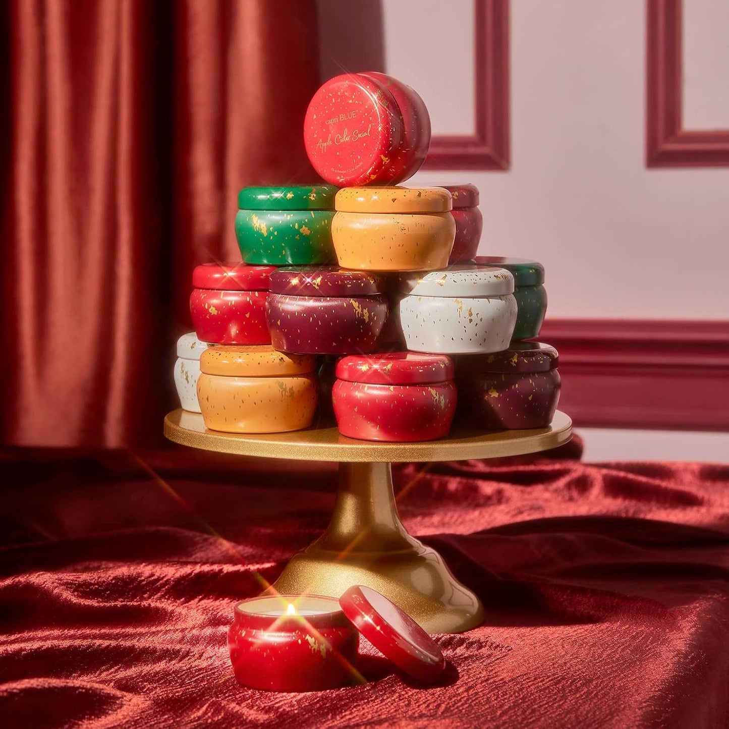 Capri Blue Glimmer Mini Tin - Apple Scented Candle with Mini Candle Holder - Soy Wax Blend - Capri Blue Apple Cider Social Red and Gold (3 oz)